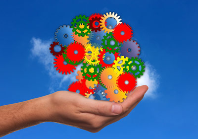 Hand holding a cloud composed of clockwork gears